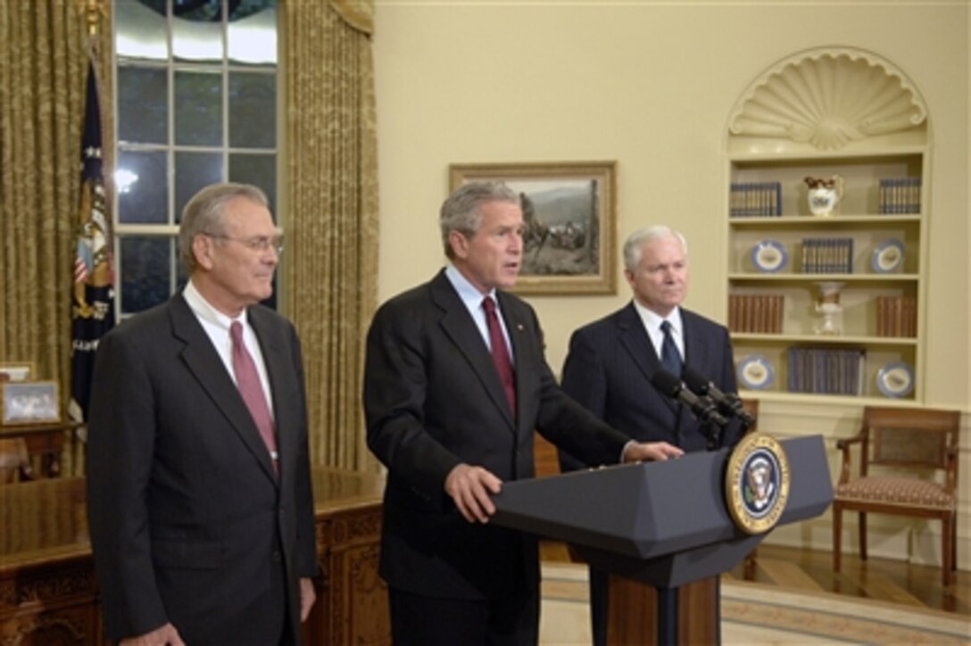 President George W. Bush (center) delivers remarks to the press in the East Room of the White House on Nov. 8, 2006.  Bush is accompanied by Secretary of Defense Donald H. Rumsfeld (left) and Secretary of Defense nominee Robert Gates (right).  