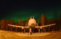 EIELSON AIR FORCE BASE, Alaska -- The Big Dipper constallation and the Aurora Borealis, or Northern Lights, shine above a static A-10 Thunderbolt 2 in Heritage Park at Eielson Air Force Base, Alaska on 18 September 2004. The lights are the result of solar particles colliding with gases in Earth's atmosphere. Early Eskimos and Indians believed different legends about the Northern Lights such as they were the souls of animals dancing in the sky or the souls of fallen enemies trying to rise again. A-10 Aircraft are currently flown by the 355th Fighter Squadron stationed at Eielson AFB.
(U.S. Air Force Photo by Senior Airman Joshua Strang)