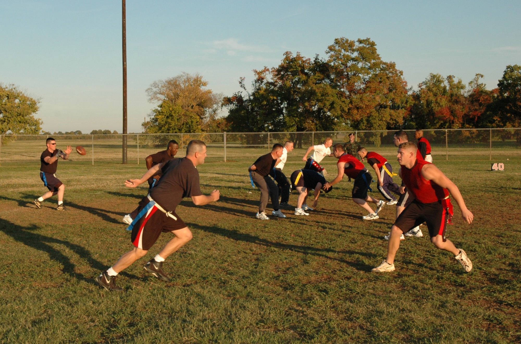 917th Security Forces Squadron members compete against one another in their annual flag football competition between technical sergeants and above and staff sergeants and below. The game proved to favor the more "experienced" players, as the "seniors" walked away with a 36-22 win over the "juniors." (U.S. Air Force photo/Tech. Sgt. Sherri Savant)