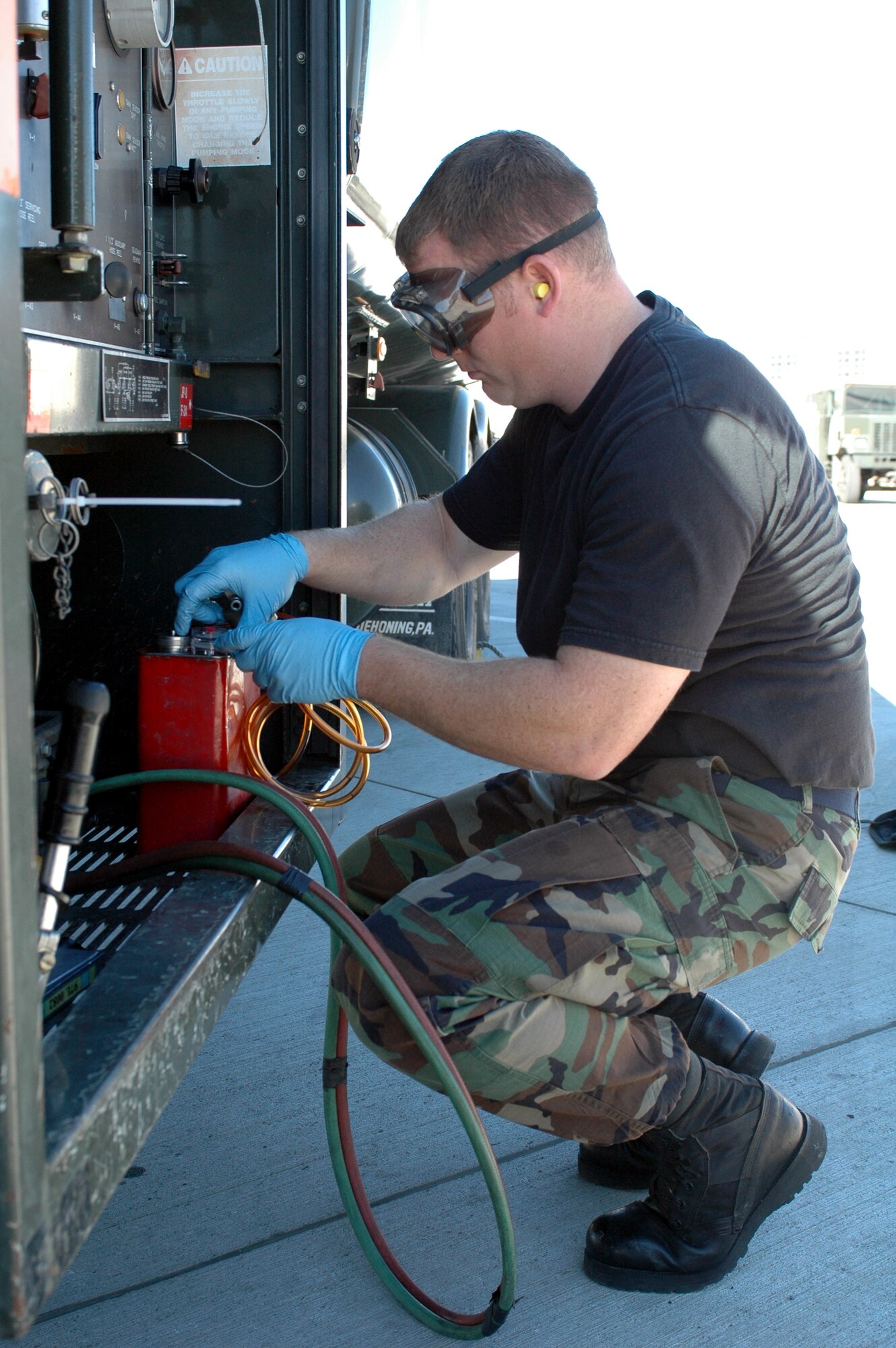 Staff Sgt. Andy Tallmadge, 60th Logistics Readiness Squadron fuel laboratory technician, tests for fuel impurities. In addition to supporting Travis’ KC-10, C-5 and C-17 aircraft, the 60th LRS also support the Navy’s VQ3 detachment E6-B aircraft. (U.S. Air Force photo by Tech. Sgt. Donald Osborn/ 60th Air Mobility Wing Public Affairs)