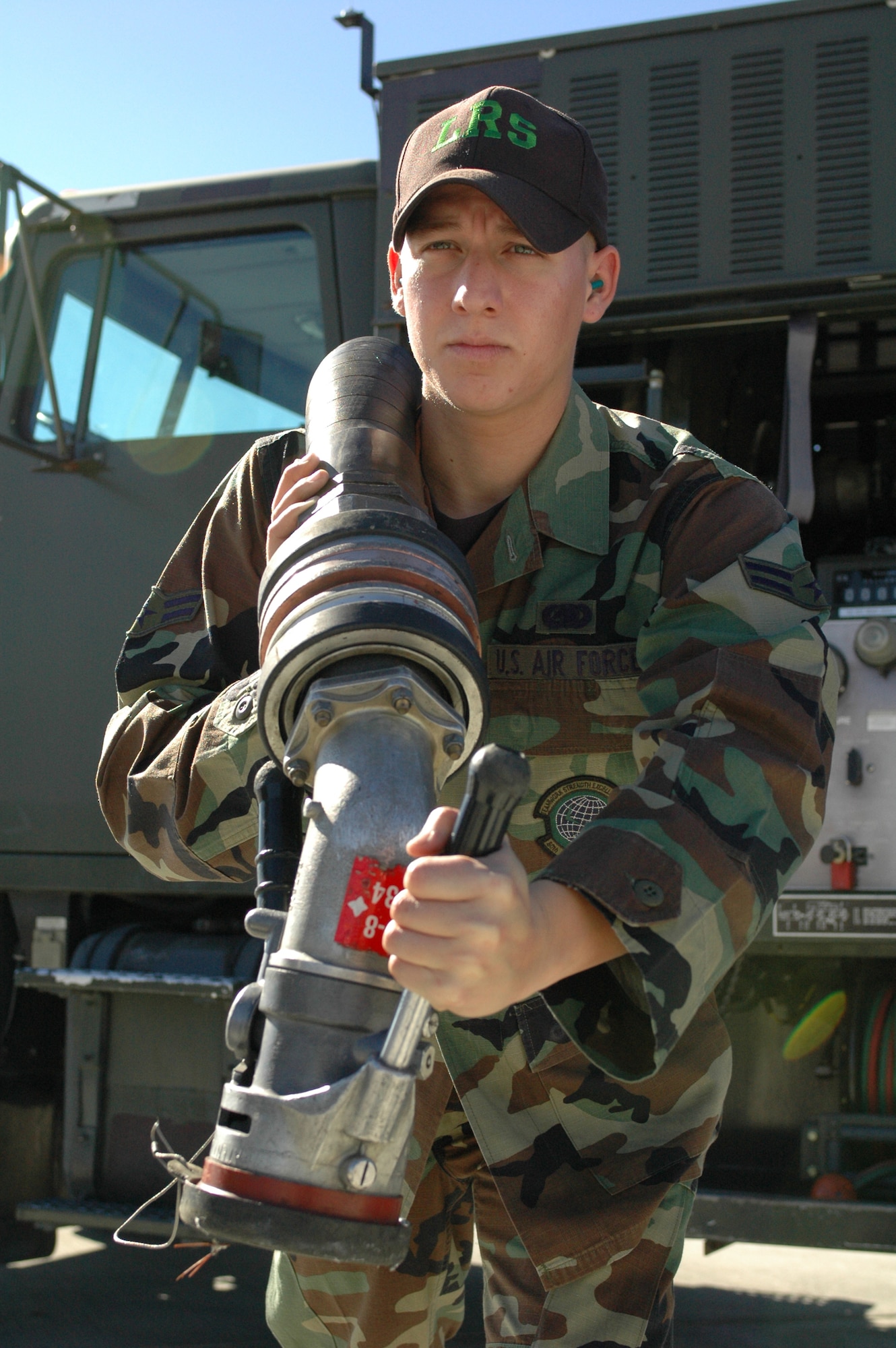 Airman 1st Class Tony Melendez, 60th Logistics Readiness Squadron, pulls a hose used to refuel an aircraft. The 60th LRS fuels management flight is currently competing for the William H. Penton Award. (U.S. Air Force photo by Tech. Sgt. Donald Osborn/ 60th Air Mobility Wing Public Affairs)