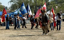 Val Shadowhawk leads flag bearers into the arena during the Grand Entry portion of the Travis Air Force Base’s Fifth Annual Veterans’ Pow-Wow Nov. 5. The flag bearers consisted of active duty, Reservists and veterans. (U.S. Air Force photo by Staff Sgt. Candy Knight/60th Air Mobility Wing Public Affairs)