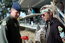 Col. Steven Arquiette, 60th Air Mobility Wing commander, discusses Native American traditions with Al Garlick during Travis Air Force Base’s Fifth Annual Native American Veterans’ Pow-Wow Nov. 4. (U.S. Air Force photo by Staff Sgt. Candy Knight/60th Air Mobility Wing Public Affairs)
