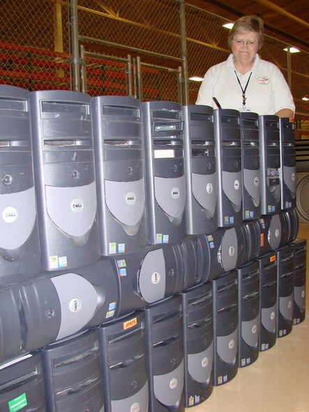 Betty Comer, Computer Science Corporation computer support section, checks the inventory of old computers being readied for donation to a local public school for use by students in computer training. Old computers are also given to other government and law  enforcement agencies.(Photo by Frank McIntyre)