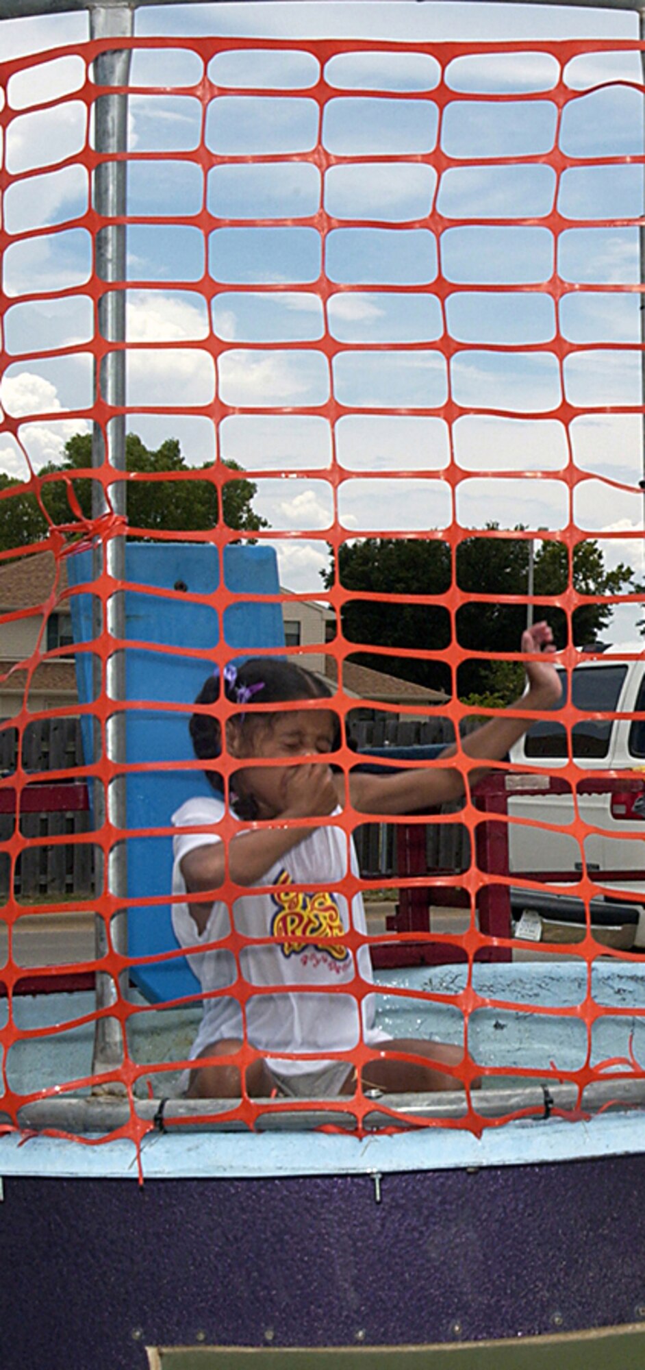 Several organizations set up shop during Freedom Fest July 4 to provide entertainment and games for festival-goers. Sheppard’s youth center operated a dunking booth to raise funds for future youth center activities. Kiera Mirich-Holder holds her nose as a lucky contestant hit the bulls eye. She is the daughter of Tech. Sgt. Michael Holder and Angela Mirich-Holder.  (U.S. Air Force photo/Sandy Wassenmiller).