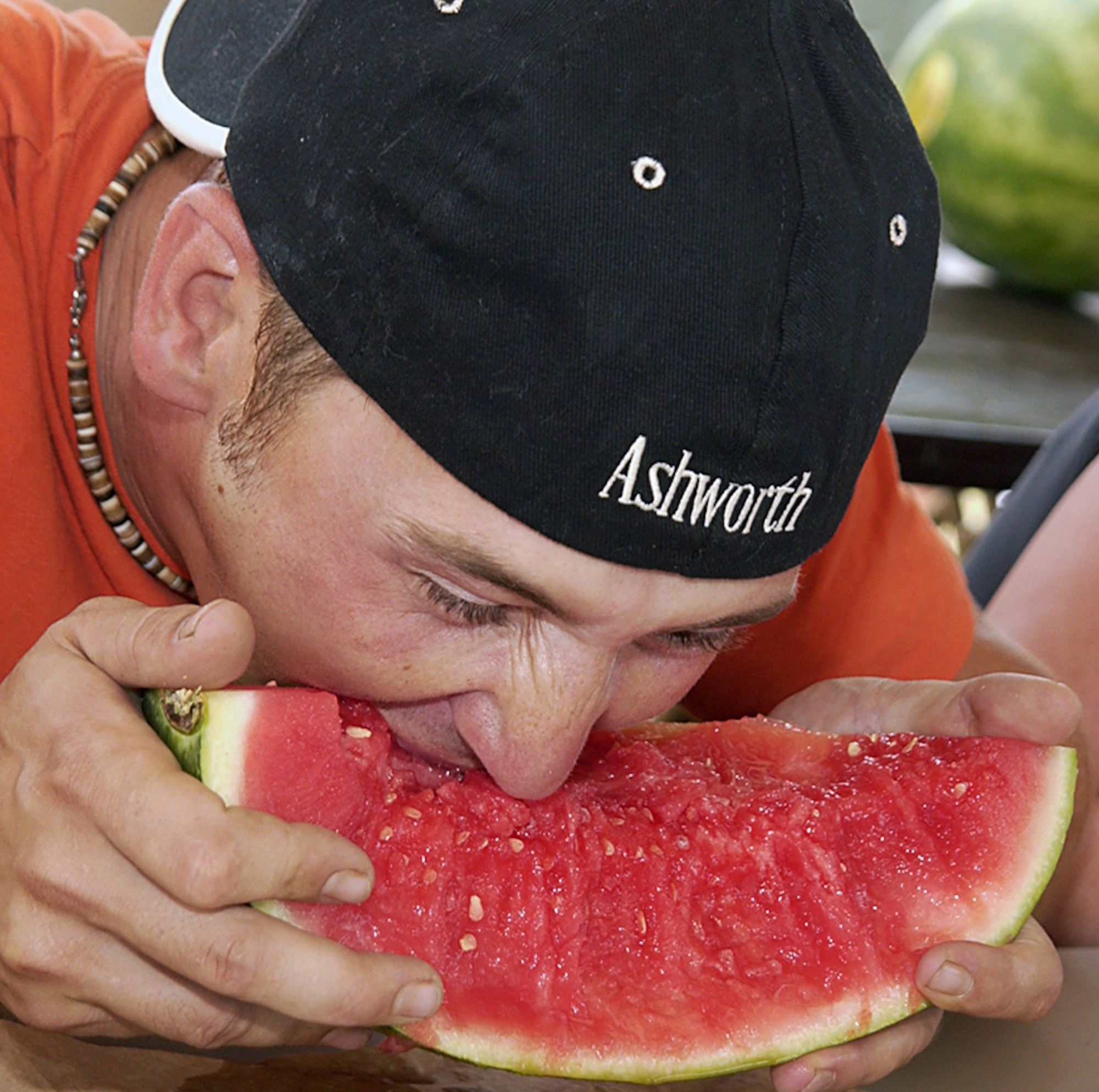 A hungry man digs into a juicy watermelon during Freedom Fest 2006's watermelon eating contest.  (U.S. Air Force photo/Sandy Wassenmiller).