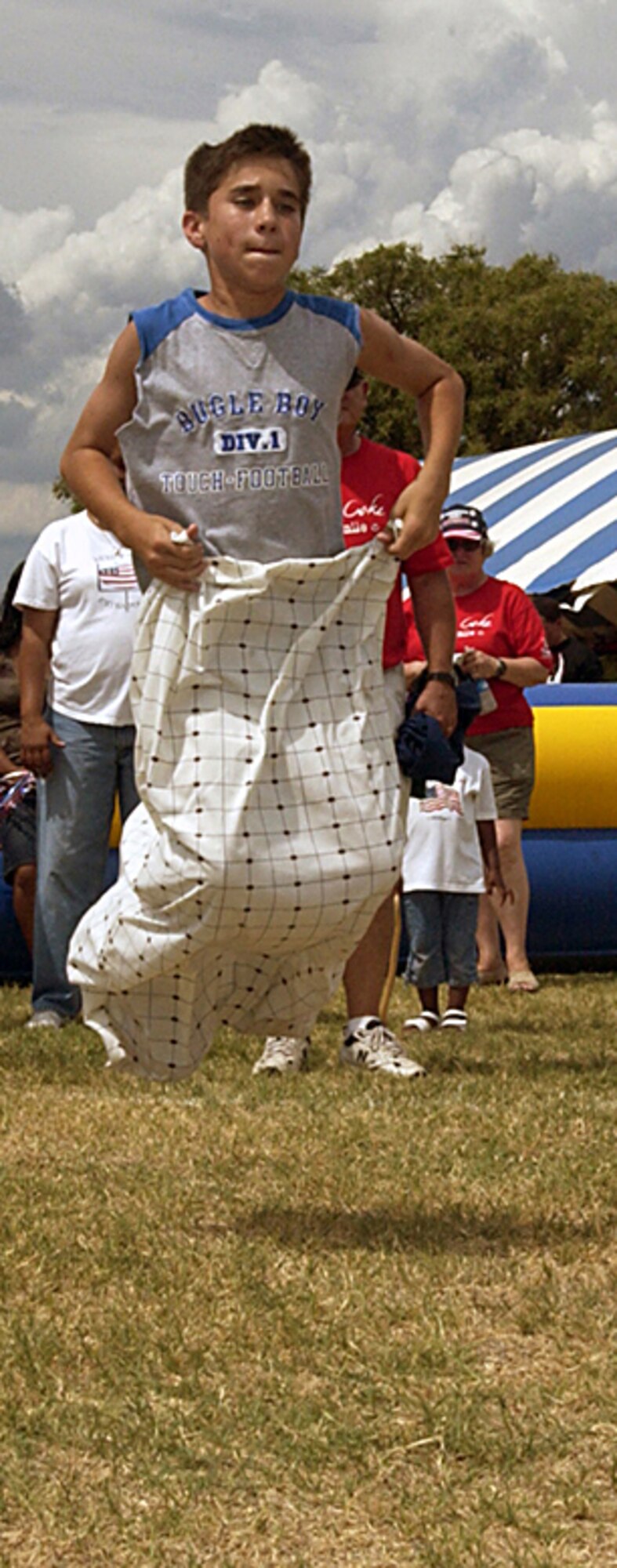 Traditional games such as the sack race and three-legged race provided entertainment for guests of all ages during Sheppard’s Freedom Fest 2006.A young man gets off to a good hop during a sack race. (U.S. Air Force photo/Sandy Wassenmiller).