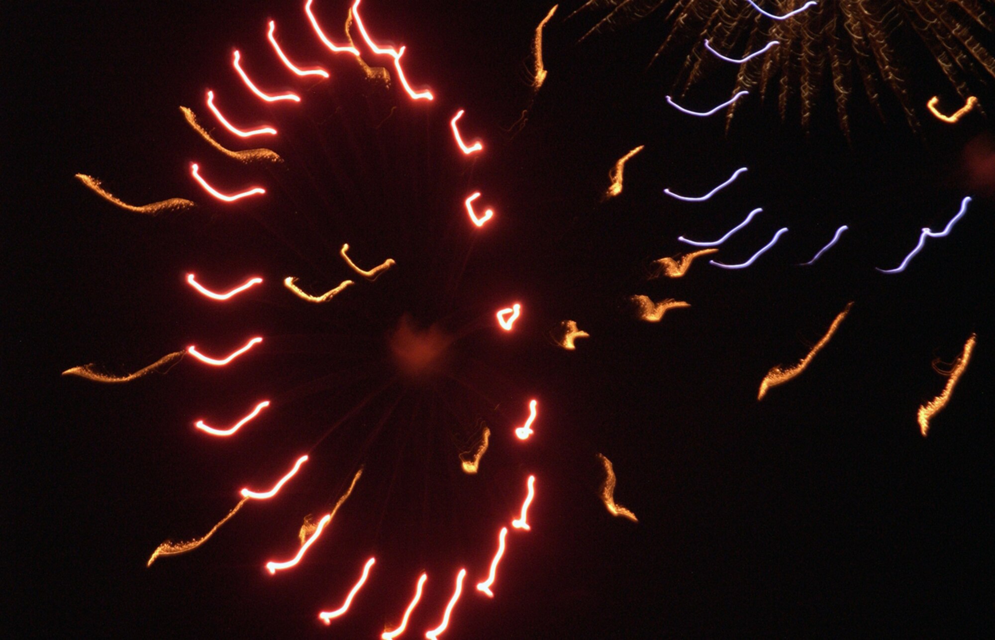 Fireworks explode in the dark Texas sky to celebrate the United States’ 230th birthday. (U.S. Air Force photo/Sandy Wassenmiller).