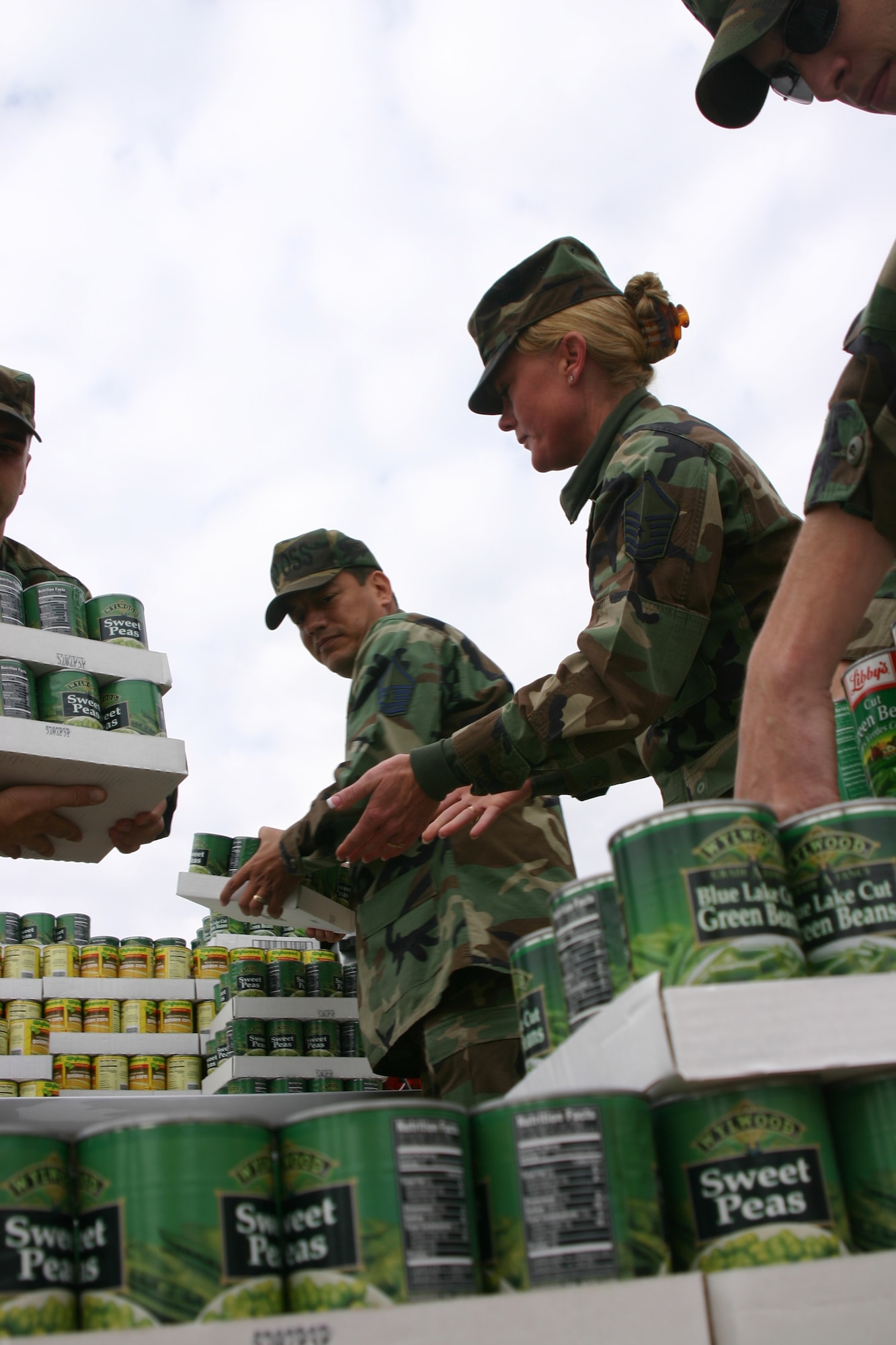 Master Sgts. Gil De La Cerda and Angela Patterson, both from the 80th Operations Support Squadron, unload canned good at the Wichita Falls Area Food Bank Friday during the annual U Can Share Food Drive. Sheppard personnel delivered more than 21,000 pounds to the center. (U.S. Air Force photo/John Ingle)