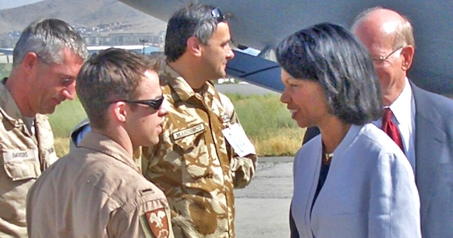 First Lt. David Braun, 32nd Flying Training Squadron, talks to Secretary of State Condoleezza Rice during her June visit to Afghanistan, where he is deployed with Combined Forces Command - Afghanistan at Camp Eggers.(Courtesy photo)