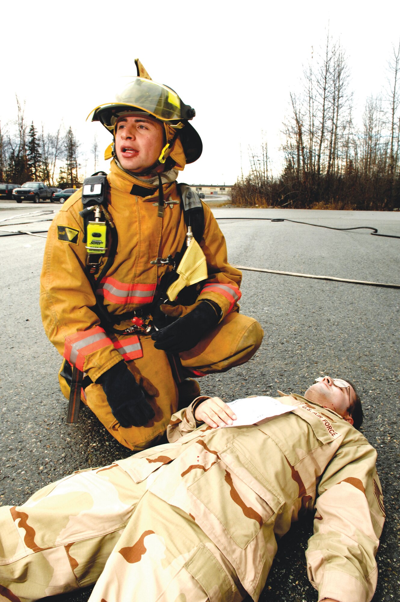 ELMENDORF AIR FORCE BASE, Alaska -- Senior Airman Ricky Sandoval, 3rd Civil Engineer Squadron, responds to a simulated casualty at the munitions area. The 3rd Wing tested its ability to deploye during a Polar Force Phase I Operational Readiness Exercise Oct. 17-20. (U.S. Air Force photo by Airman 1st Class Jonathan Steffan)