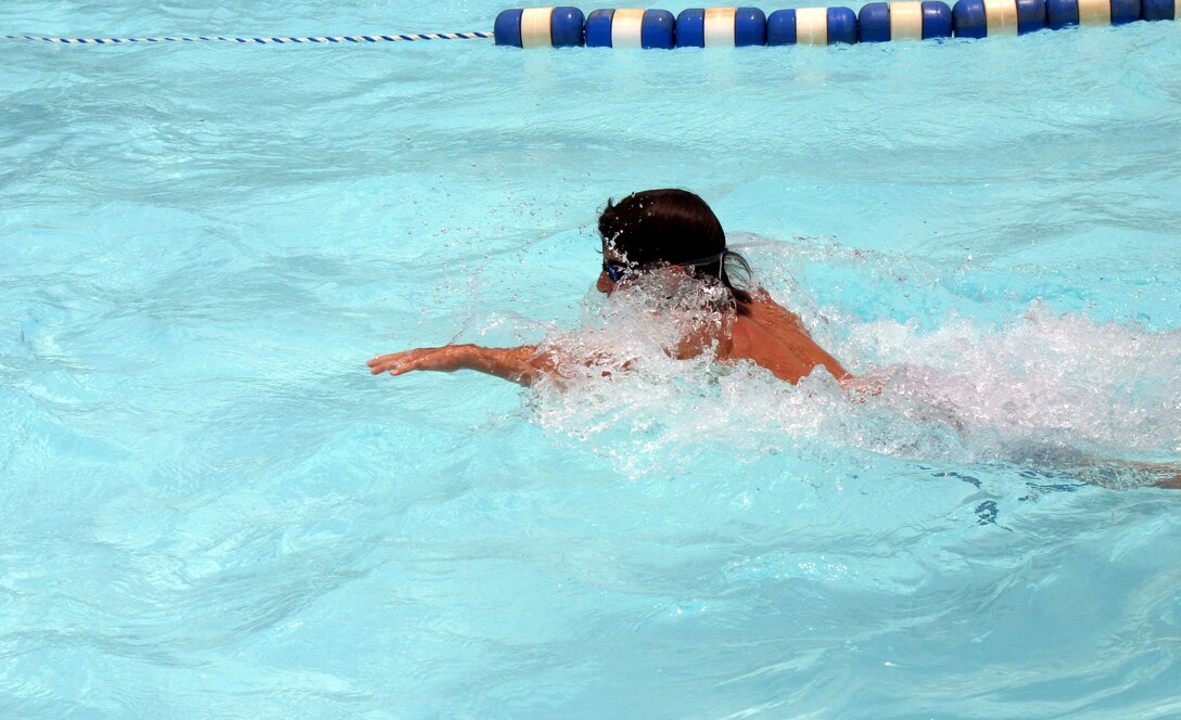 Toren Lombardo swims at the Bunker Hill pool Monday. Lombardo’s mother, Valerie Lombardo, said that it has always been important to her to make sure her children take swimming lessons. Even with her sons experience swimming, Lombardo likes to watch him whenever he is in the water. (U.S. Air Force photo/Airman Jacob Corbin).