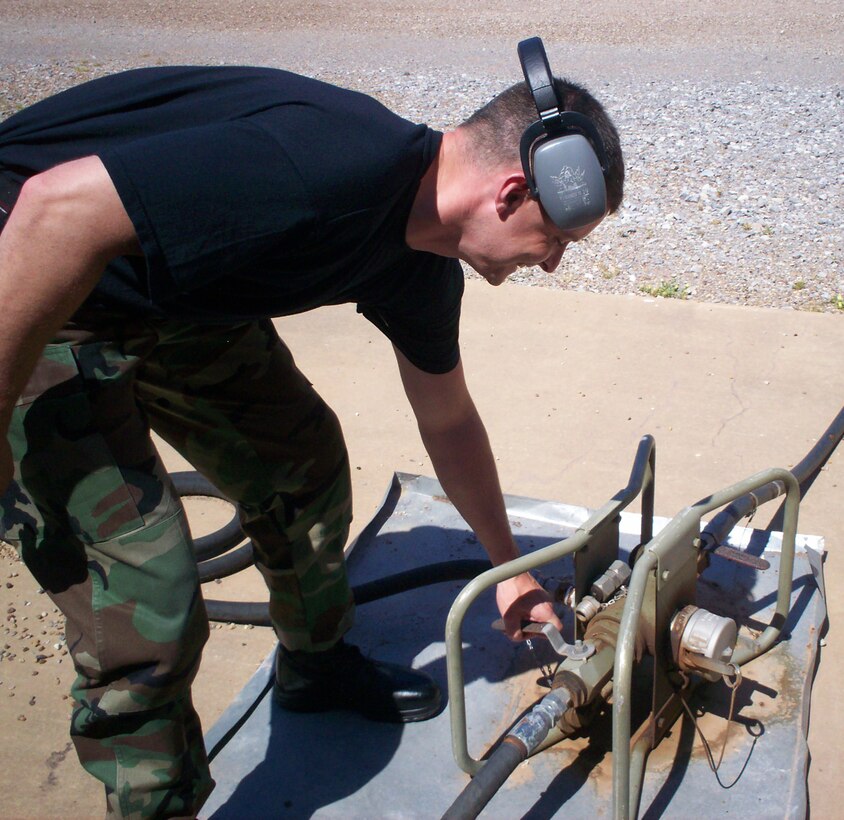 Staff Sgt. Chuck Paulson switches on the fuel for a MEP-12 at the 366th Training Squadron's Bare Base Power course. (U.S. Air Force photo/Robert Fox)