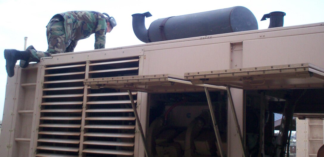 Staff Sgt. Chuck Paulson, a student in Sheppard's bare base power course, preps the mission essential power generator, MEP-12. (U.S. Air Force photo/Robert Fox)