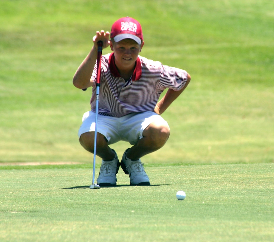 Tad Darland, from Panama City, Fla., sizes up a putt Monday at Wind Creek Golf Course. Darland has been playing golf for three years. (U.S. Air Force photo/Airman Jacob Corbin).