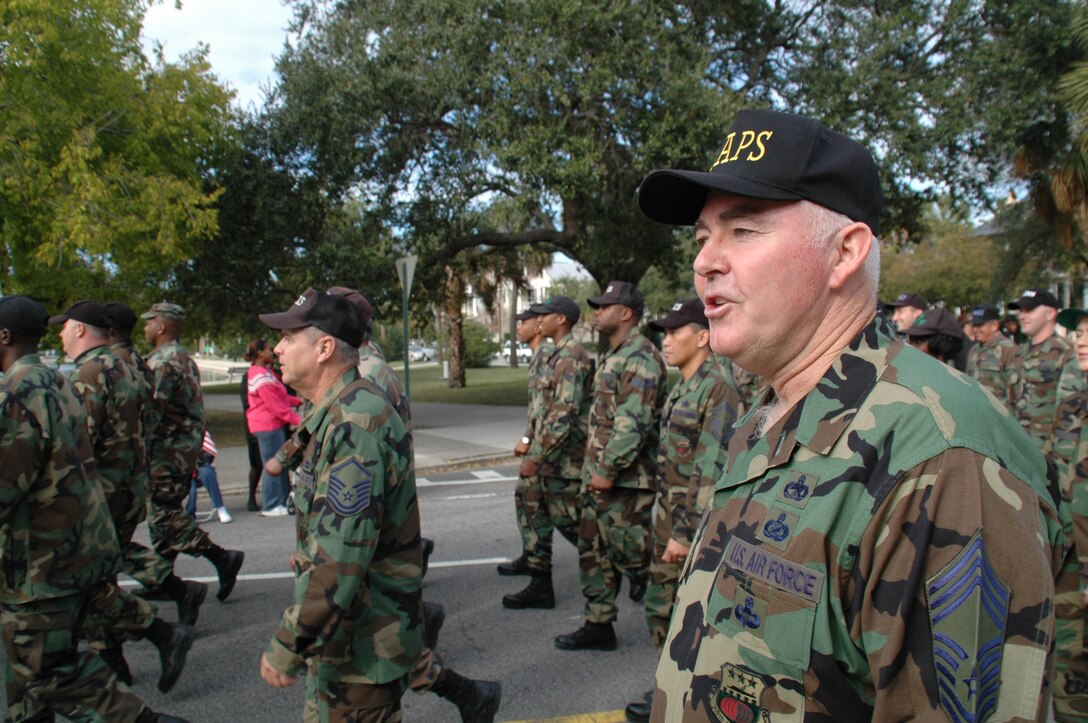 Chief Master Sgt. Charlie Hall, 81st Aerial Port Squadron, calls out cadence during to the 315th Airlift Wing flight during the annual Veterans Day Parade in downtown Charleston, S.C., Nov. 5. (photo by Capt. Capps)