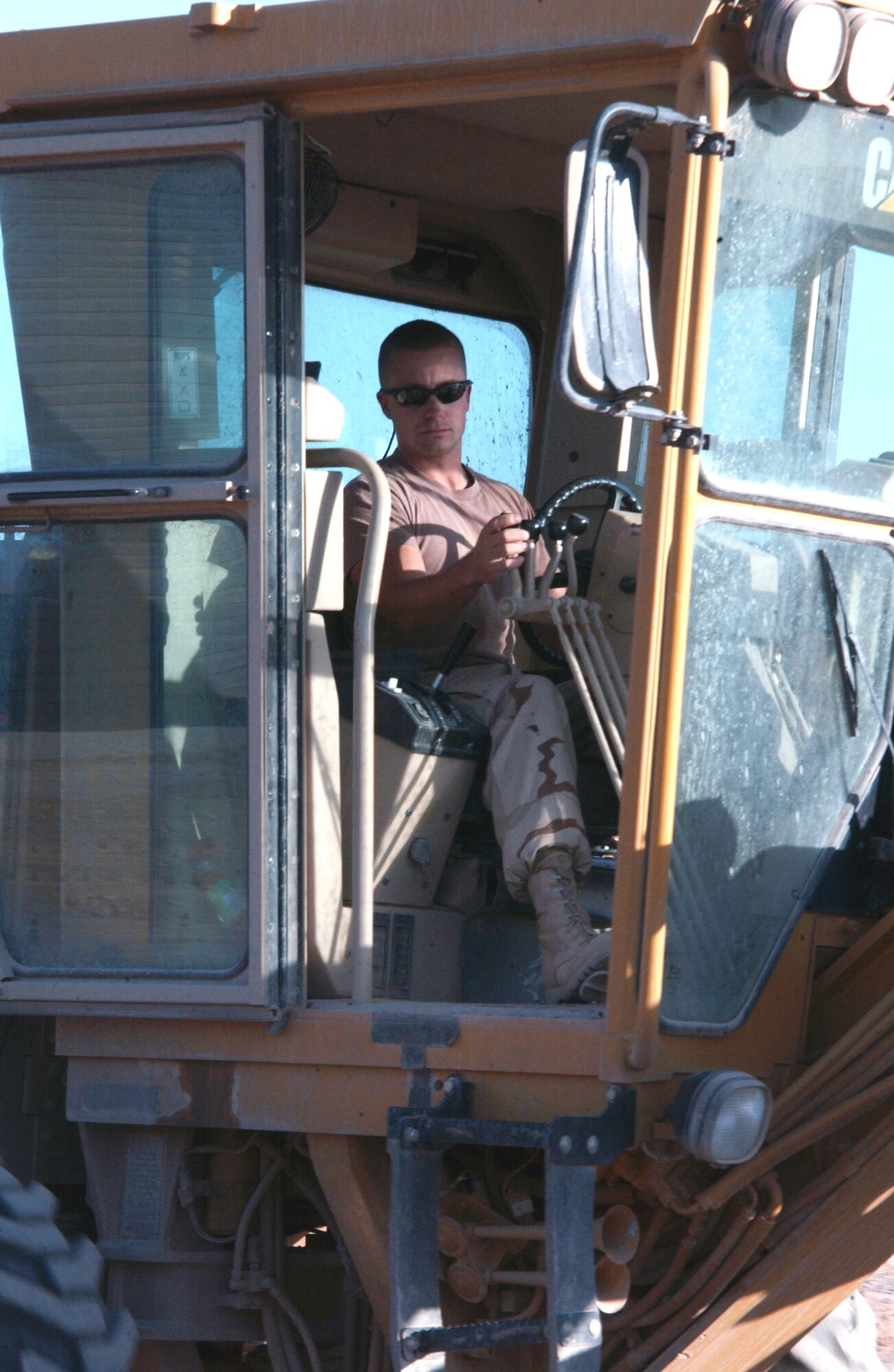 Staff Sgt. Shawn Ziesler operates a grader to level ground Nov. 1 at Balad Air Base, Iraq. Sergeant Ziesler is a 332nd Expeditionary Civil Engineer Squadron pavements and equipment craftsman deployed from Eglin Air Force Base, Fla. (U.S. Air Force photo/Staff Sgt. Alice Moore)