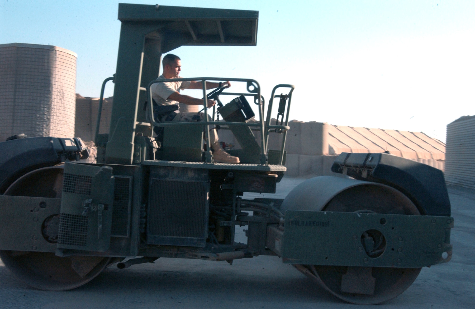 Senior Airman William Cravener operates a steel wheel roller Nov. 3 at Balad Air Base, Iraq. Airman Cravener is a 332nd Expeditionary Civil Engineer Squadron pavements and equipment journeyman deployed from Spangdahlem Air Base, Germany. (U.S. Air Force photo/Staff Sgt. Alice Moore) 

