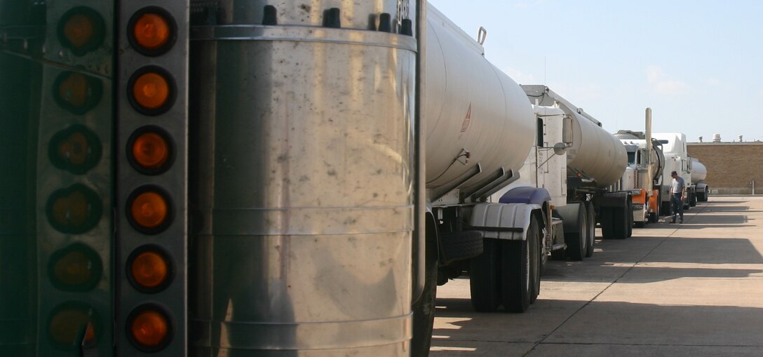 A line of trucks offload jet fuel at Sheppard's depot recently. The 80th Flying Training Wing uses about 130,000 gallons of fuel each day. (U.S. Air Force photo/Robert Fox)