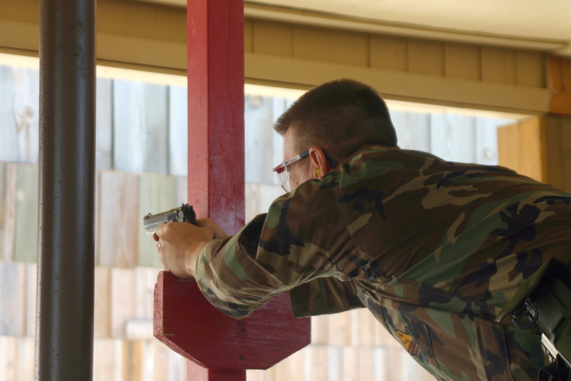 82nd Mission Support Group commander Col. Steven McKay shoots an M9 pistol to qualify. Seven of Sheppard’s commanders shot for qualification Wednesday morning. Colonel McKay shot 35 out of 45. (U.S. Air Force photo/Airman Jacob Corbin).