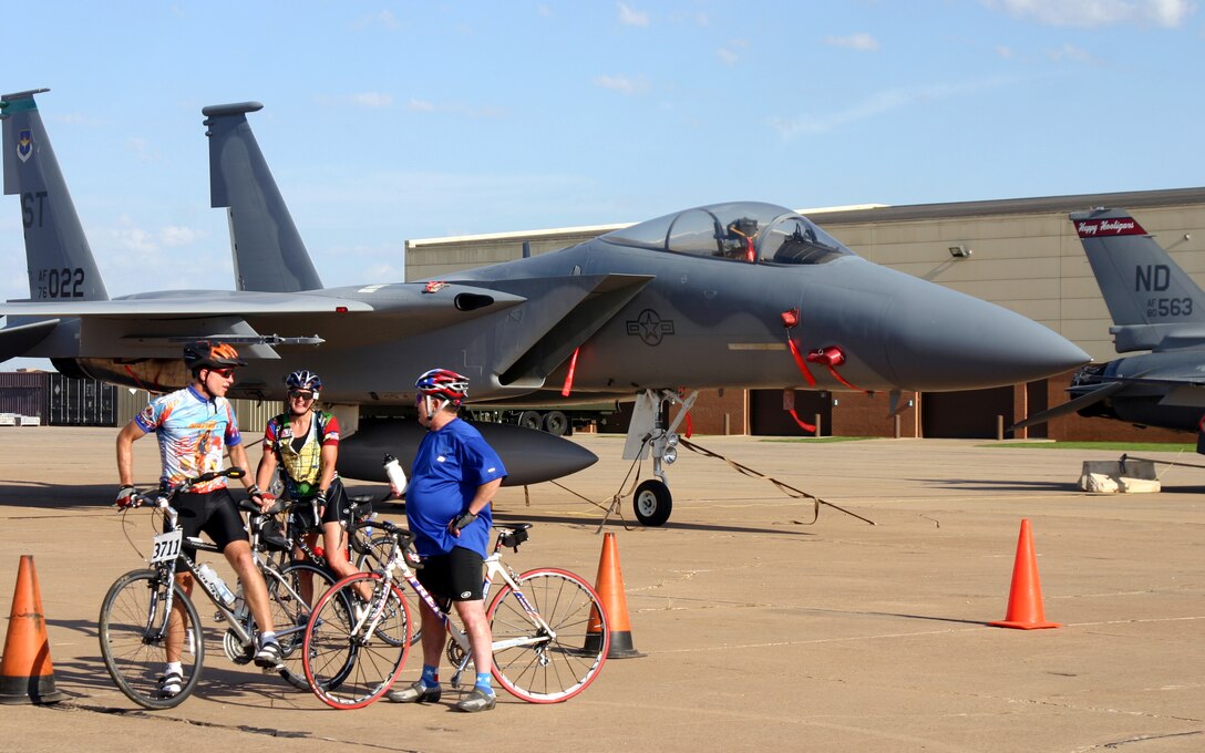 Brig. Gen. Richard Devereaux, 82nd Training Wing commander, stops to explain more about Sheppard to new-found friends Charles and Joyce Talbott during the Hotter 'N Hell Hundred Aug. 26. (U.S. Air Force photo/Airman Jacob Corbin)