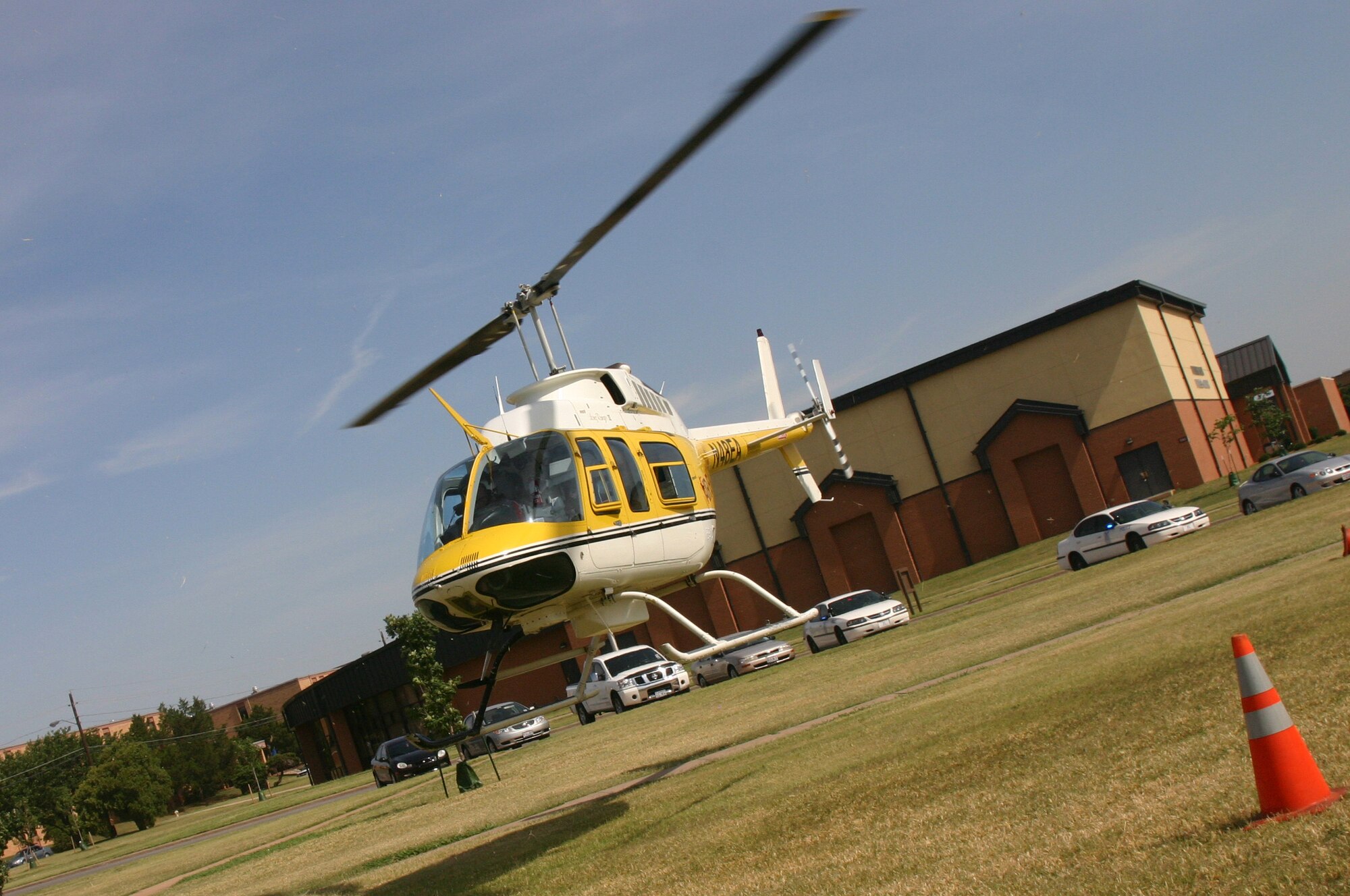 Life Flight pilot Tim Rogers lands the Life Flight helicopter in the field next to the community center to put it on display at the 82nd Training Wing Safety Day Fair. (U.S. Air Force photo/Senior Airman Jacque Lickteig).