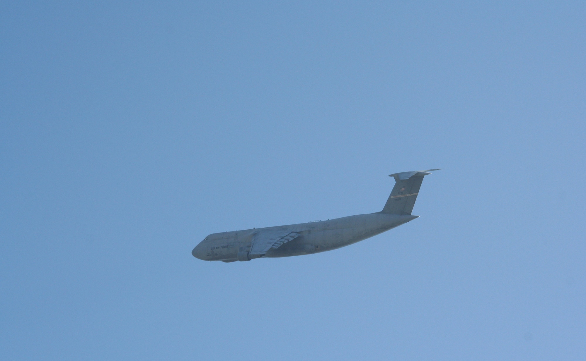 Cincinnati, Ohio – A C-5 Galaxy aircraft from the Air Force Reserve's 445th Airlift Wing located at Wright-Patterson AFB, Ohio fly’s over Dorl Field in Norwood, Ohio, a suburb of Cincinnati, to start the ceremony for “The Wall That Heals” on November 9th. Several spectators and media were oh hand to watch the aircraft.  (U.S. Air Force Photo/Maj. Ted Theopolos).
