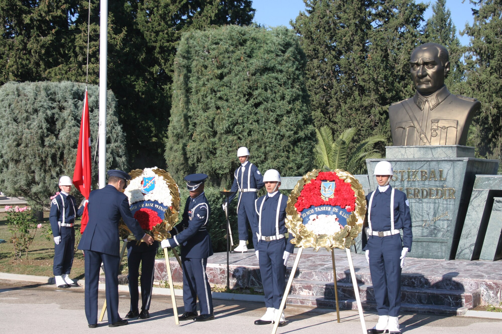 INCIRLIK AIR BASE, Turkey -- Members of the 39th Air Base Wing honor guard prepare a memorial wreath as members of the 10th Tanker Air Force honor guard stand at attention during a joint-Turkish and U.S. Air Force formation commemorating Mustafa Kemal Ataturk Nov. 10. This year marks the 68th anniversary of Ataturk's death.  Ataturk, the founder and first president of the modern Republic of Turkey, set up schools, separated religious affairs from state affairs and granted women equal rights as men. (U.S. Air Force photo by Senior Airman Patrice Clarke)
