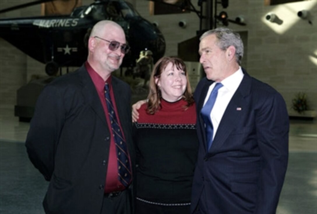 President George W. Bush meets with Dan and Deb Dunham, the parents of fallen Marine Cpl. Jason Dunham who will receive the Medal of Honor, at the dedication ceremony for the National Marine Corps Museum in Triangle, Va., Nov. 10, 2006.