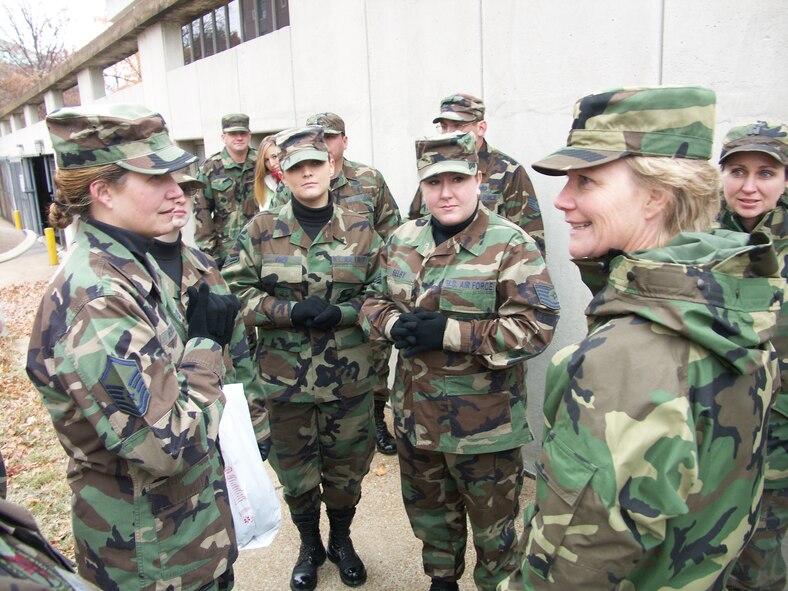 Members of the 932nd Airlift Wing listen to their commander, Col. Maryanne Miller, as they prepare for a cold march in the frigid November air in the 2006 Veteran's Day Parade.  Veterans were honored by members of the 932nd Airlift Wing, Air Force Reserve Command, located at Scott Air Force Base, Ill.  Would you like to join these patriots?  Call 1-800-257-1212 for information.