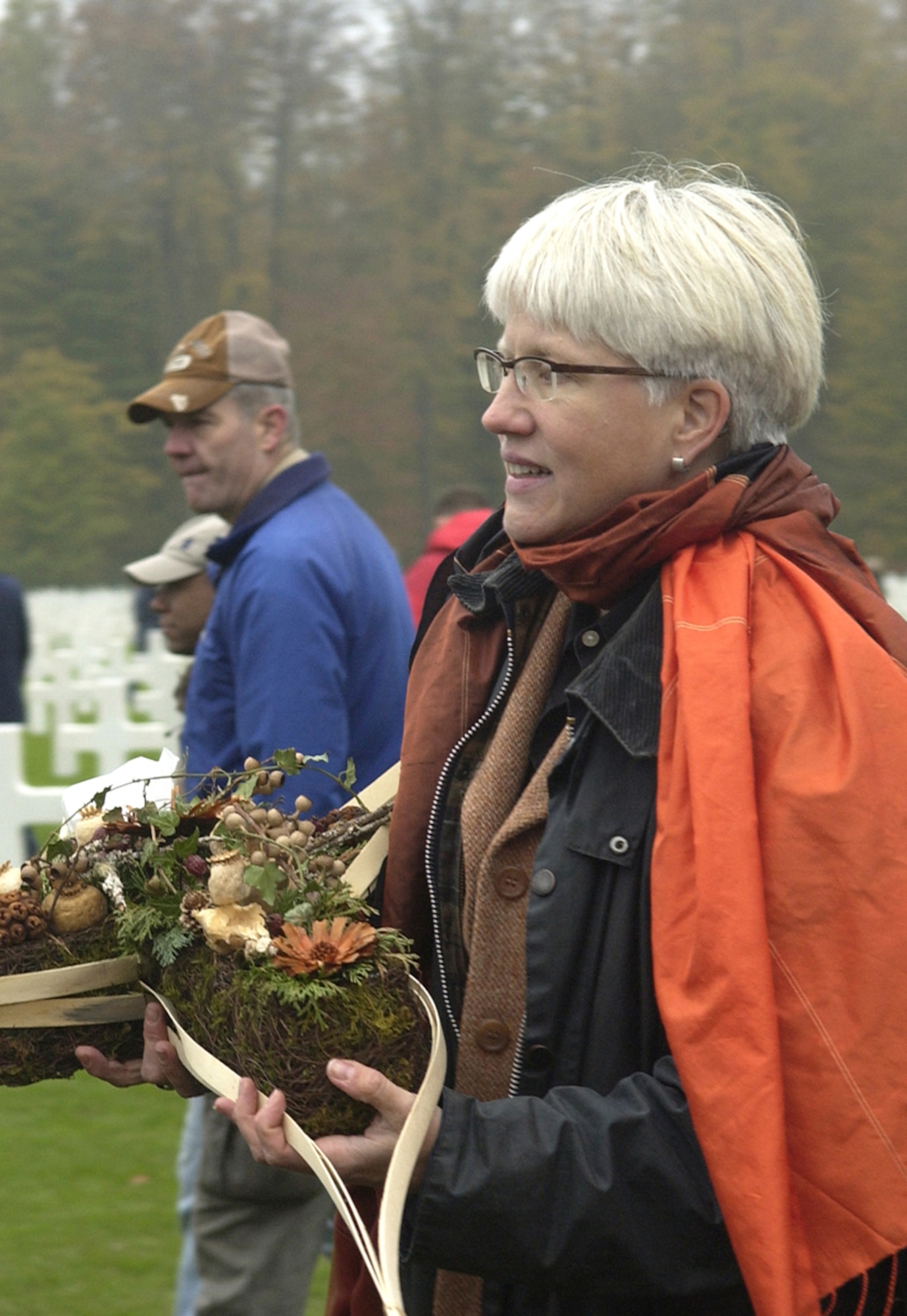 Helen Patton Plusczyk, the granddaughter of the late Gen. George S. Patton, prepares to decorate his cross at the Luxembourg American Cemetery and Memorial after a Veterans Day ceremony Nov. 11 in honor of those who fell while serving General Patton and liberating Luxembourg. (U.S. Air Force photo/Airman 1st Class Josie L. Kemp)