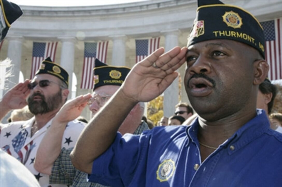 Veterans from the American Legion Post Thurmont, Md., salute during the Veterans Day ceremony at Arlington National Cemetery in Arlington, Va. where President George W. Bush lay a wreath at the Tomb of the Unknowns, and addressed veterans, their family members and guests, Nov. 11, 2006.