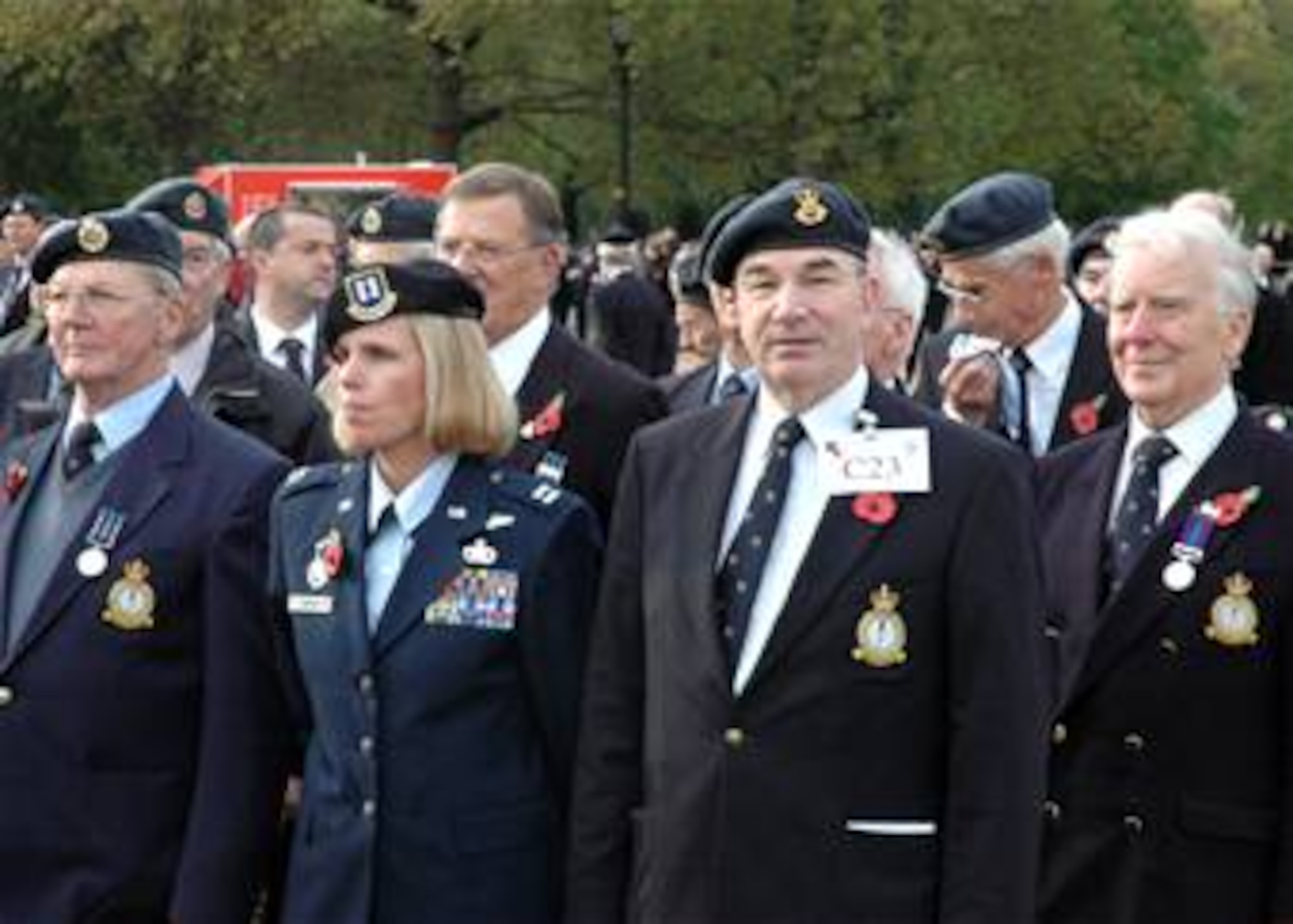 Dr. Christopher Morris (second from right) stands with Capt. Jutta Cortes as they prepare to march in the annual Remembrance Day Parade in London. This is the first year the RAF Habbaniya Association has marched in the parade. It marks the 65th anniversary of a major battle in 1941 at RAF Habbaniya, Iraq. (U.S. Air Force photo/Tech. Sgt. Scott Wakefield)
