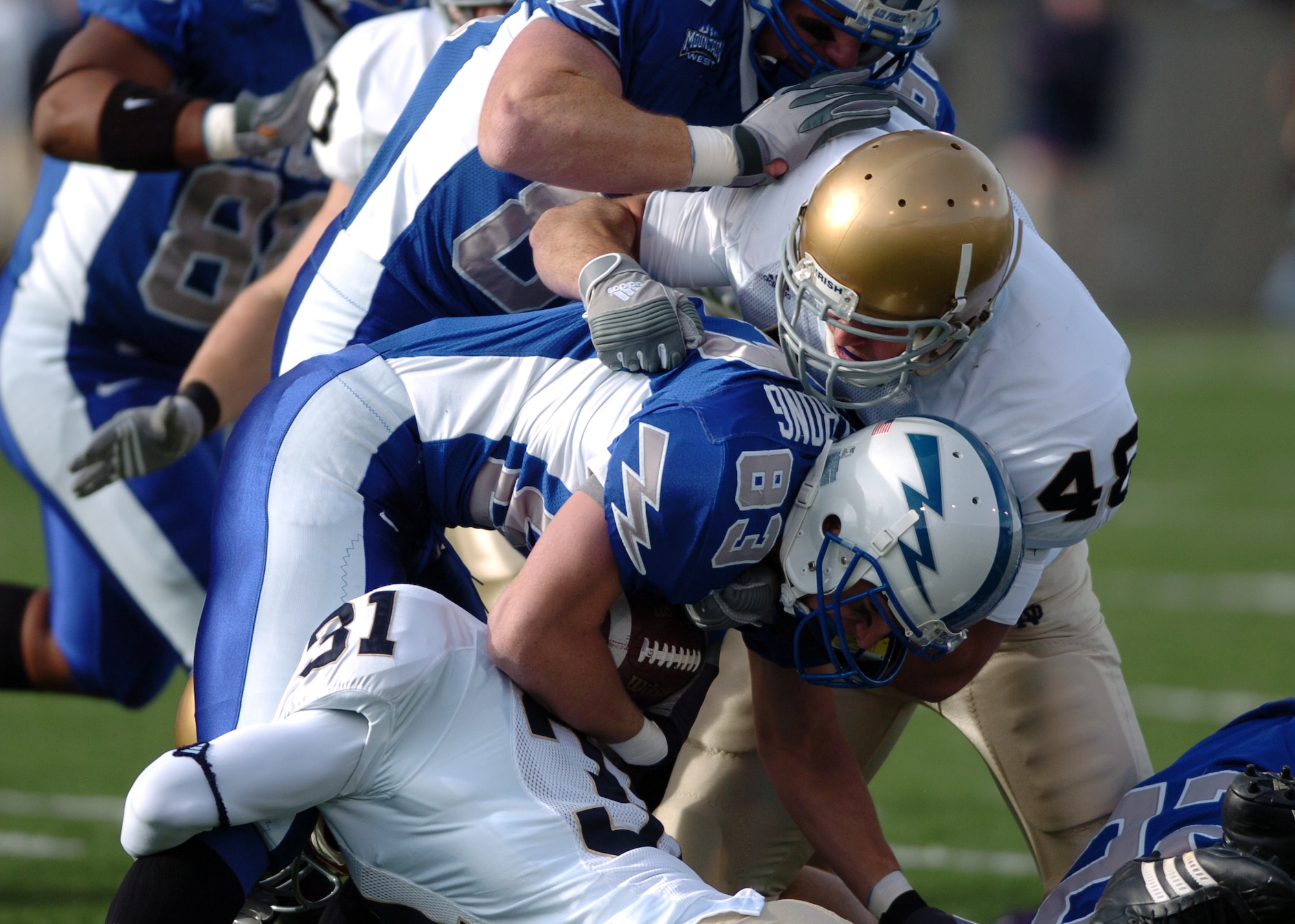 Air Force kick returner Spencer Armstrong is wrapped up by Notre Dame special teams defenders Sergio Brown and Steve Quinn after a 17-yard runback Saturday. Armstong returned three of the Irish?s five kickoffs on the day. 8th-ranked Notre Dame won, 39-17.  (U.S. Air Force photo/1st Lt. John Ross)