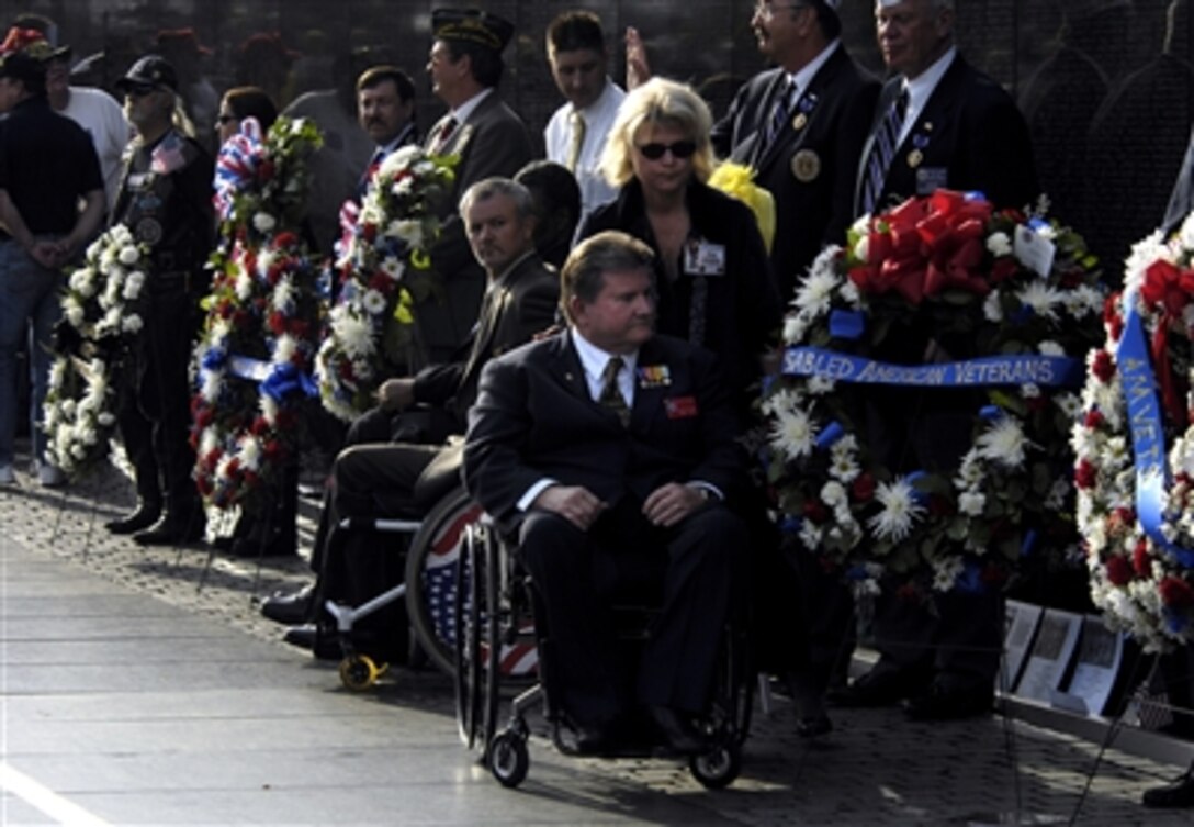 Bradley S. Barton, Disabled American Veterans National Commander, participates in a wreath laying ceremony as part of a Veterans Day celebration at the Vietnam War Memorial, Nov. 11, 2006.  