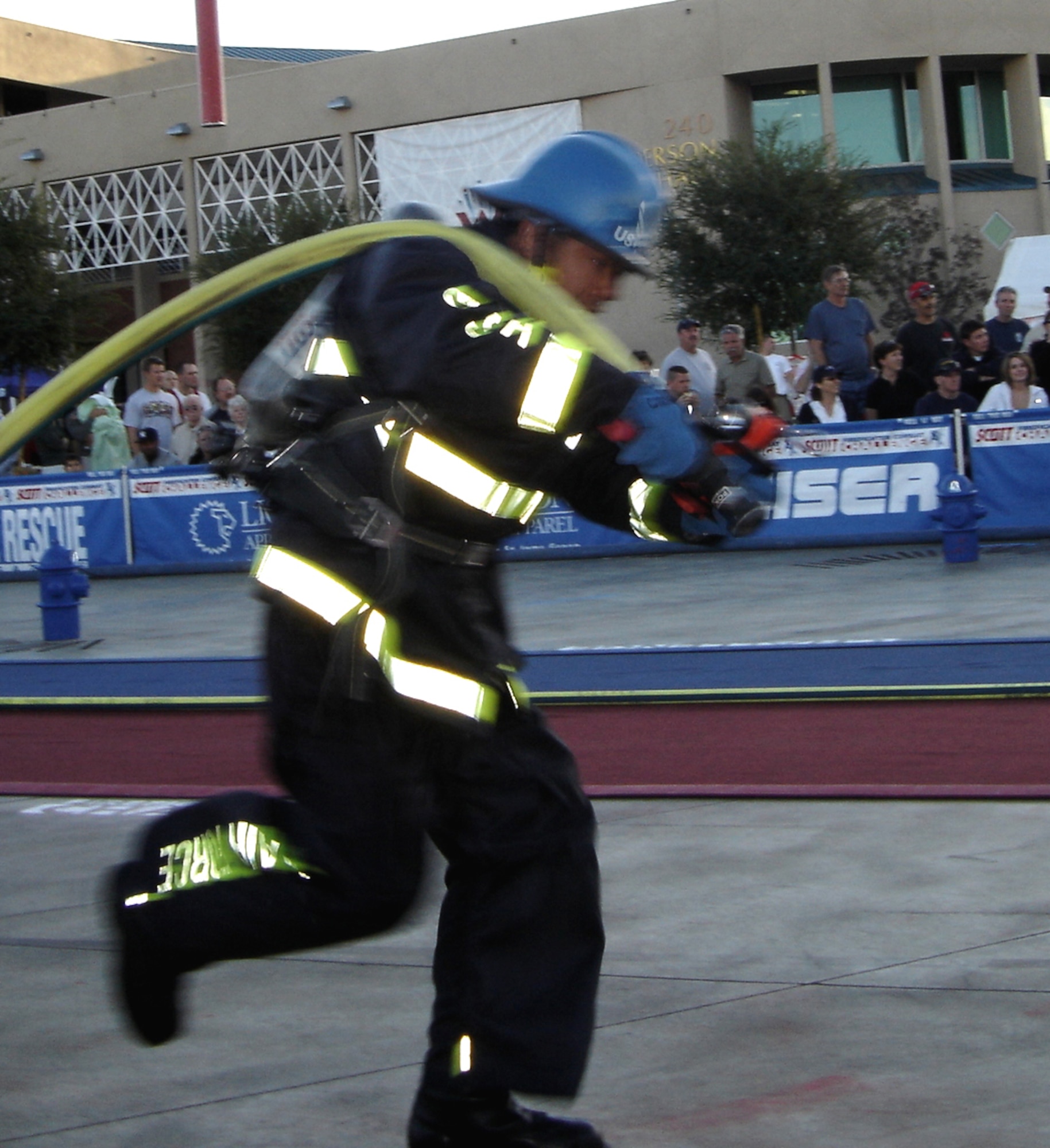HENDERSON, Nev. -- Mr. Aldrico Caragan drags a fire hose 100 feet during the World Firefighter Combat Challenge Nov. 11. Team Travis won the competition for the third consecutive year. This was Mr. Caragan's first year with the team. (U.S. Air Force photo by Senior Master Sgt. Jeff Vaughn/ 60th Civil Engineer Squadron)
