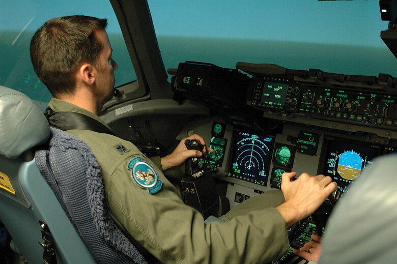 Lt. Col. Ed. Schloeman, a Reserve pilot with the 326th Airlift Squadron at Dover Air Force Base, Del., conducts training in a C-17 simulator at McGuire Air Force Base, N.J. Colonel Schloeman completed C-17 school this summer at Altus Air Force Base, Okla., and is required to log as much as 115 to 120 hours of simulator time as part of his training. The first of 13 C-17s is slated for arrival at Dover AFB late next year. The 512th Airlift Wing's 326th AS and the 436th AW's 3rd Airlift Squadron will take on the C-17 mission. (U.S. Air Force photo by 1st Lt. Marnee A.C. Losurdo)
