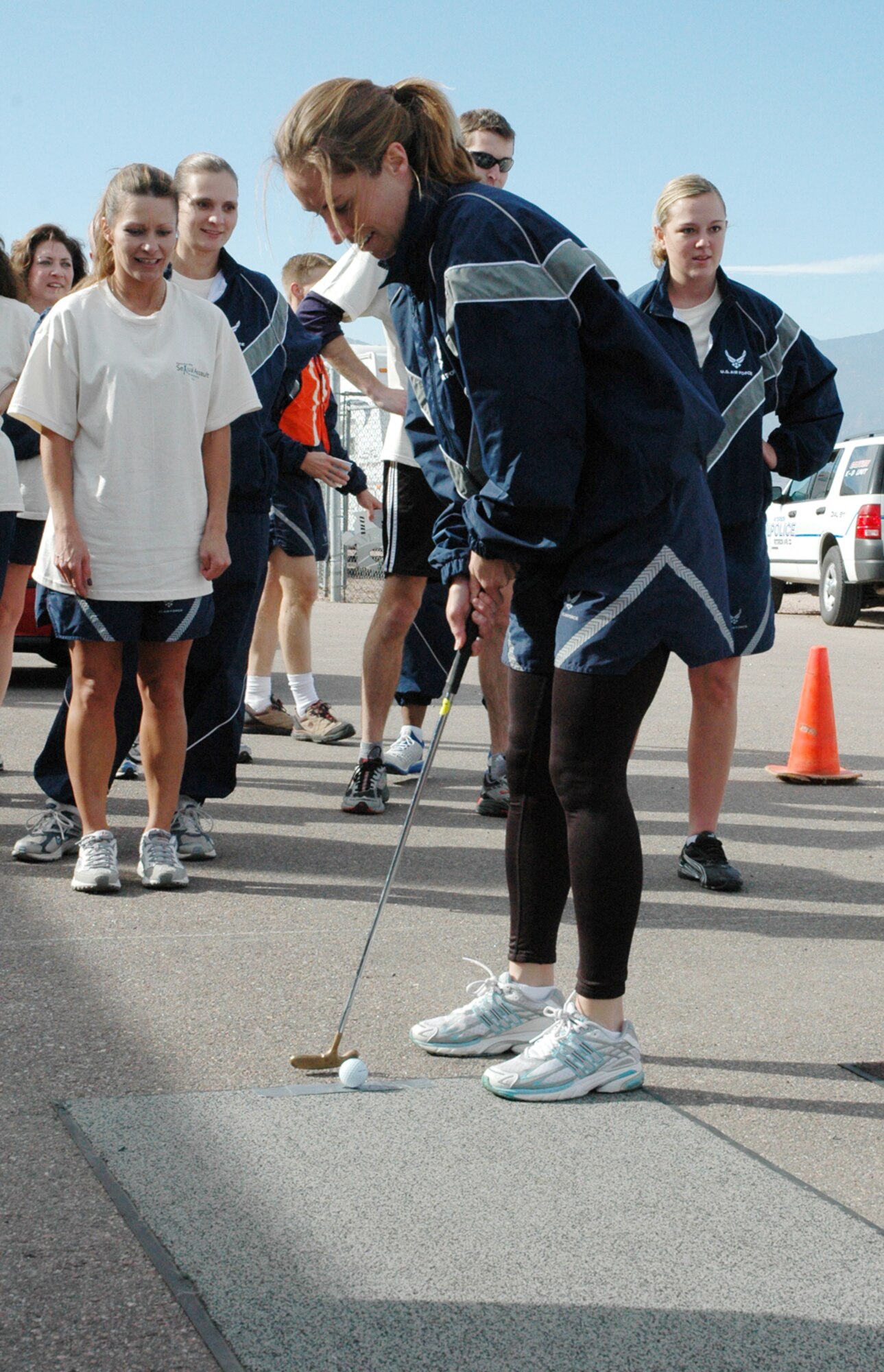 Capt. Laura DiSio, Staff Judge Advocate office, lines up a putt for the Directorate of Staff team during Wingman Day Nov. 9. The DS team won the competition by one point. (U.S. Air Force photo by Steve Brady)