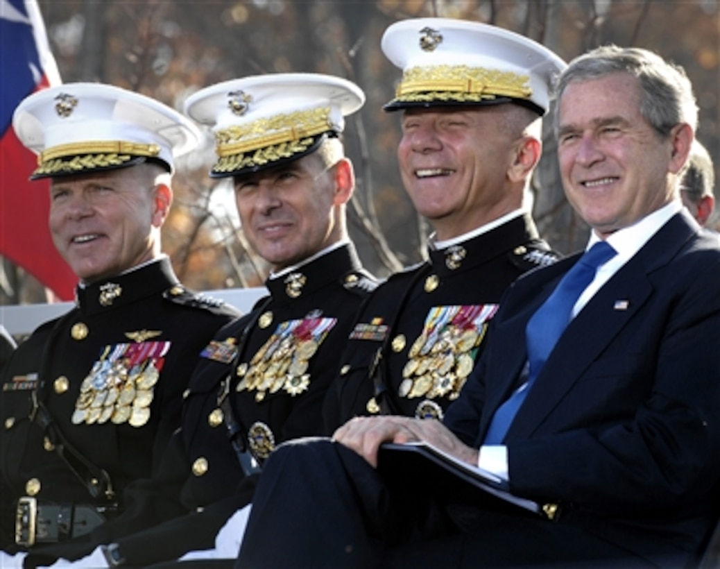President George W. Bush (right), Commandant of the Marine Corps Gen. Michael W. Hagee (2nd from right), Chairman of the Joint Chiefs of Staff Marine Gen. Peter Pace (3rd from right), and Lt. Gen. James Amos, deputy commandant for Combat Development and Integrations, attend the official opening of the National Museum of the Marine Corps during the birthday celebration of the Marine Corps in Quantico, Va., on Nov. 10, 2006.  