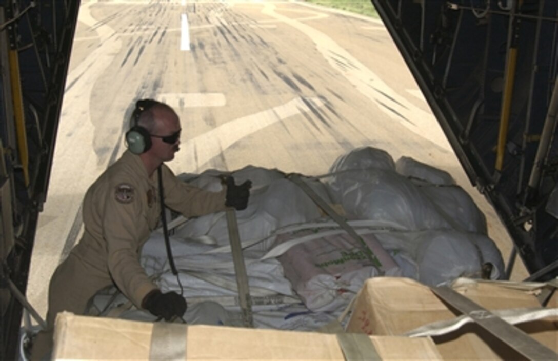 U.S. Air Force Tech. Sgt. James Cope releases a pallet of humanitarian aid for a combat off-load in Gode, Ethiopia. The U.S. Air Force C-130H Hercules aircraft  delivered humanitarian aid to flood victims in the Ogaden region of Ethiopia Nov. 10, 2006. 