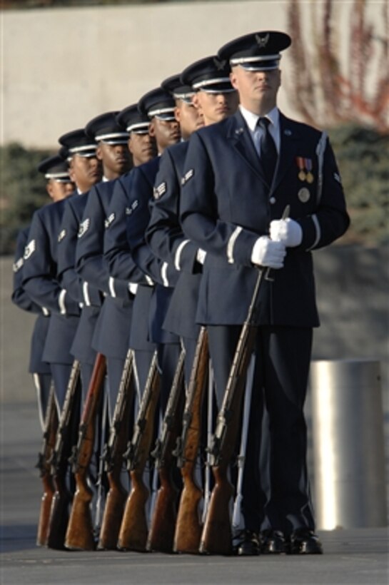 U.S. Air Force honor guardsmen stand in formation as they await the arrival of Secretary of the Air Force Michael W. Wynne and distinguished guests for a wreath-laying ceremony at the Air Force Memorial in Arlington, Va., on Nov. 10, 2006.  