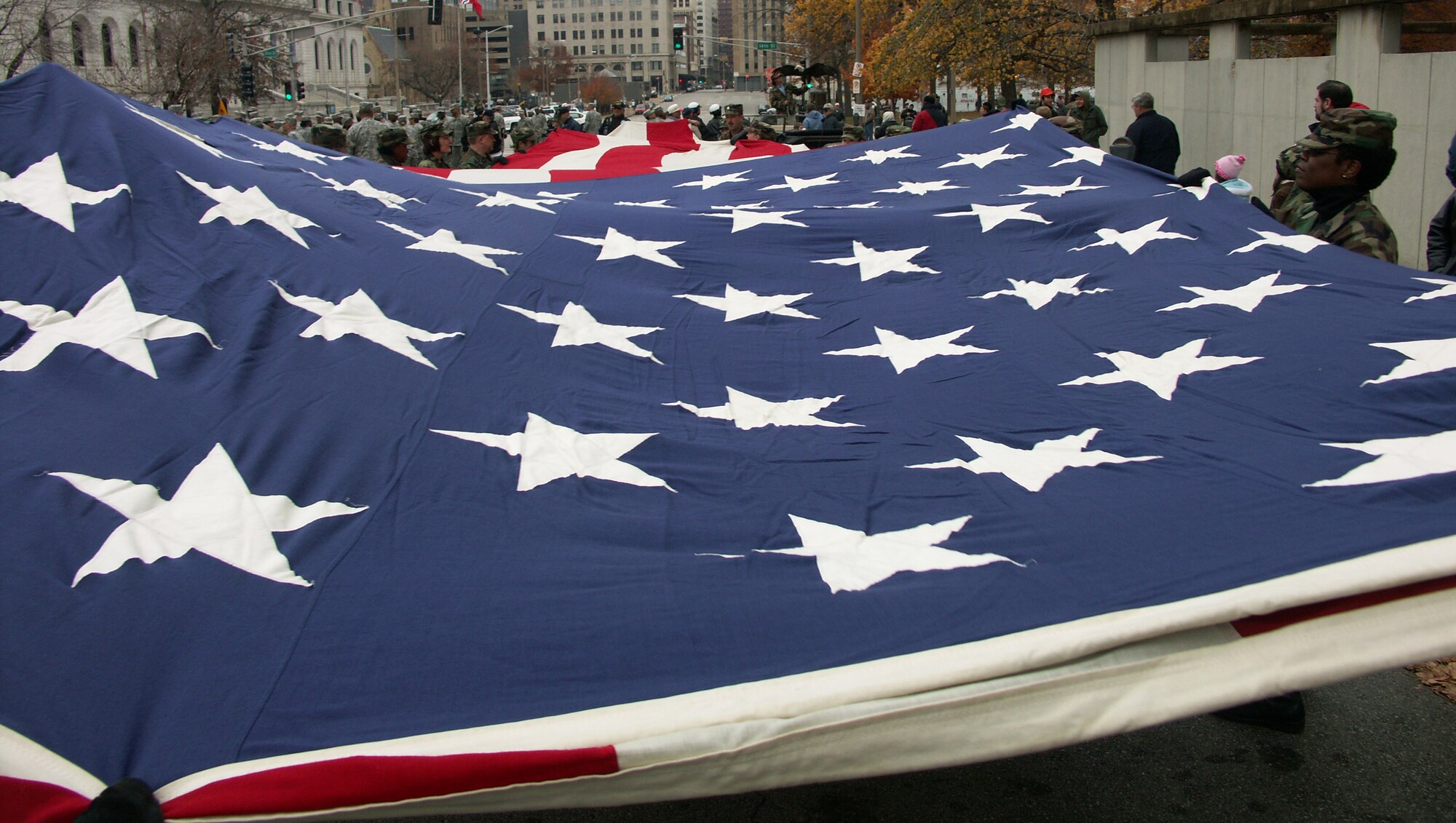 The 932nd Airlift Wing at Scott Air Force Base honors veterans by marching the American flag through the streets of Saint Louis.  The wing is an Air Force Reserve Command unit made up of approximately 1,000 Reservists.  Photo/Capt. Stan Paregien