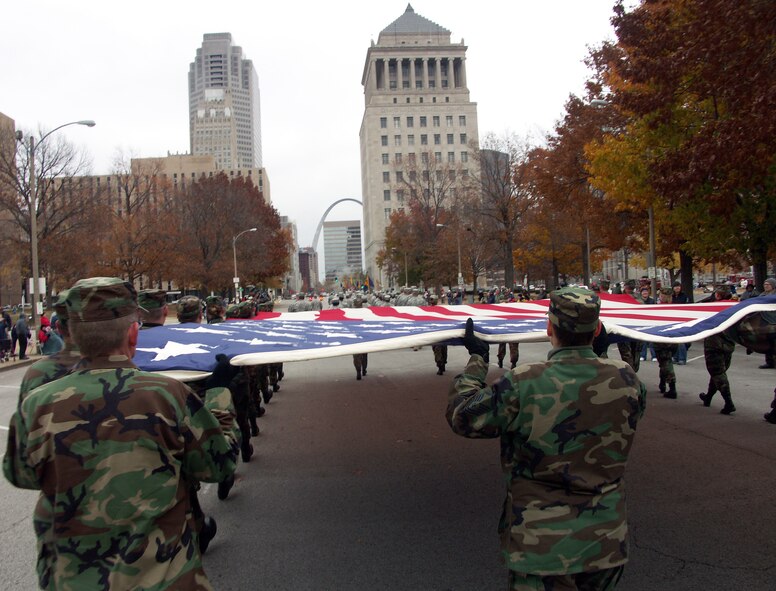 The 932nd Airlift Wing at Scott Air Force Base honors veterans by marching the American flag through the streets of Saint Louis.  The wing is an Air Force Reserve Command unit made up of approximately 1,000 Reservists.  Photo/Capt. Stan Paregien