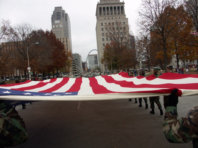 The 932nd Airlift Wing at Scott Air Force Base honors veterans by marching the American flag through the streets of Saint Louis.  The wing is an Air Force Reserve Command unit made up of approximately 1,000 Reservists.  Photo/Capt. Stan Paregien