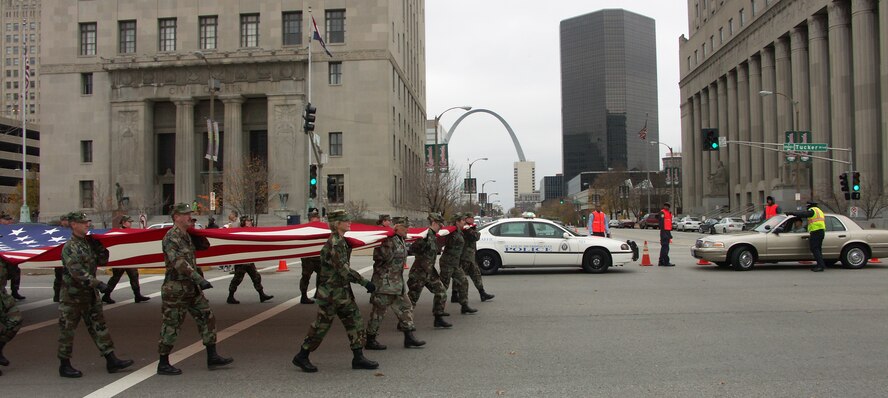 The 932nd Airlift Wing at Scott Air Force Base honors veterans by marching the American flag through the streets of Saint Louis.  The wing is an Air Force Reserve Command unit made up of approximately 1,000 Reservists.  Photo/Capt. Stan Paregien