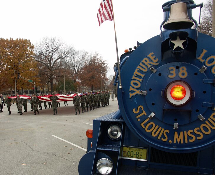 The 932nd Airlift Wing marched the American flag through the streets of Saint Louis next to a train on wheels.  The wing is an Air Force Reserve Command unit made up of approximately 1,000 Reservists.  Photo/Capt. Stan Paregien