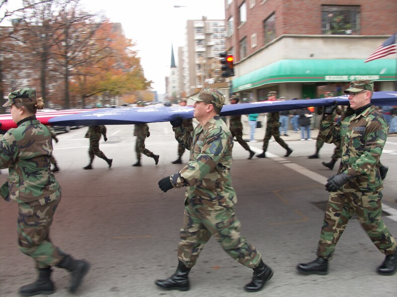 Members of the 932nd Airlift Wing at Scott Air Force Base honored veterans by marching the American flag through the streets of Saint Louis.  The wing is an Air Force Reserve Command unit made up of approximately 1,000 Reservists.  Photo/Capt. Stan Paregien