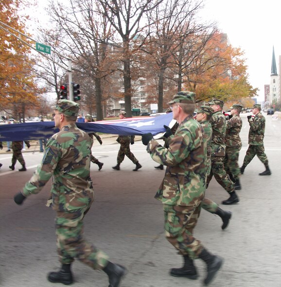 The 932nd Airlift Wing at Scott Air Force Base honors veterans by marching the American flag through the streets of Saint Louis.  The wing is an Air Force Reserve Command unit made up of approximately 1,000 Reservists.  Photo/Capt. Stan Paregien