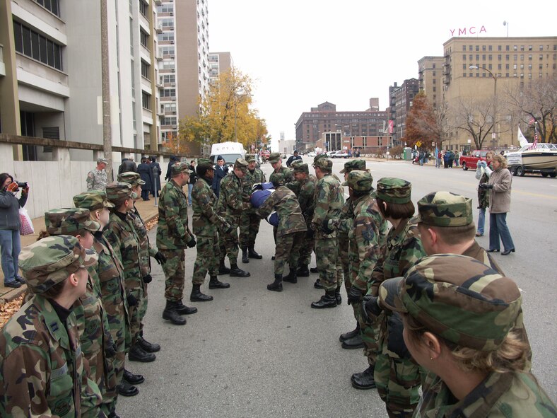 The 932nd Airlift Wing at Scott Air Force Base honors veterans by marching the American flag through the streets of Saint Louis.  The wing is an Air Force Reserve Command unit made up of approximately 1,000 Reservists.  Photo/Capt. Stan Paregien