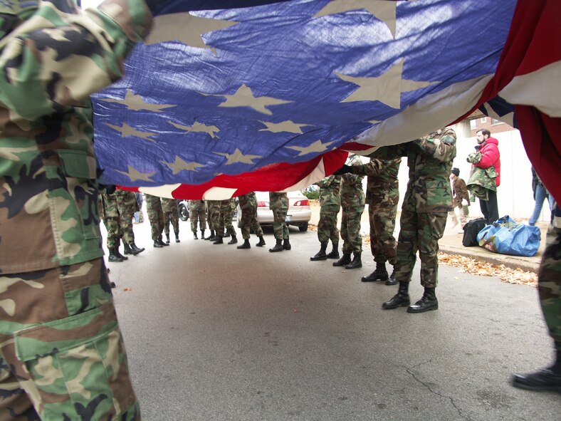 The 932nd Airlift Wing at Scott Air Force Base honors veterans by marching the American flag through the streets of Saint Louis.  The wing is an Air Force Reserve Command unit made up of approximately 1,000 Reservists.  Photo/Capt. Stan Paregien